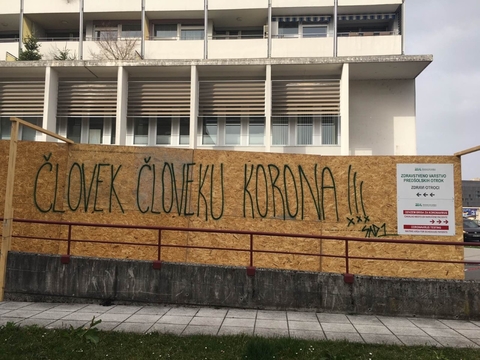 Graffiti. Ljubljana, Slovenia, March 27, 2020. "Man is Corona to Man".